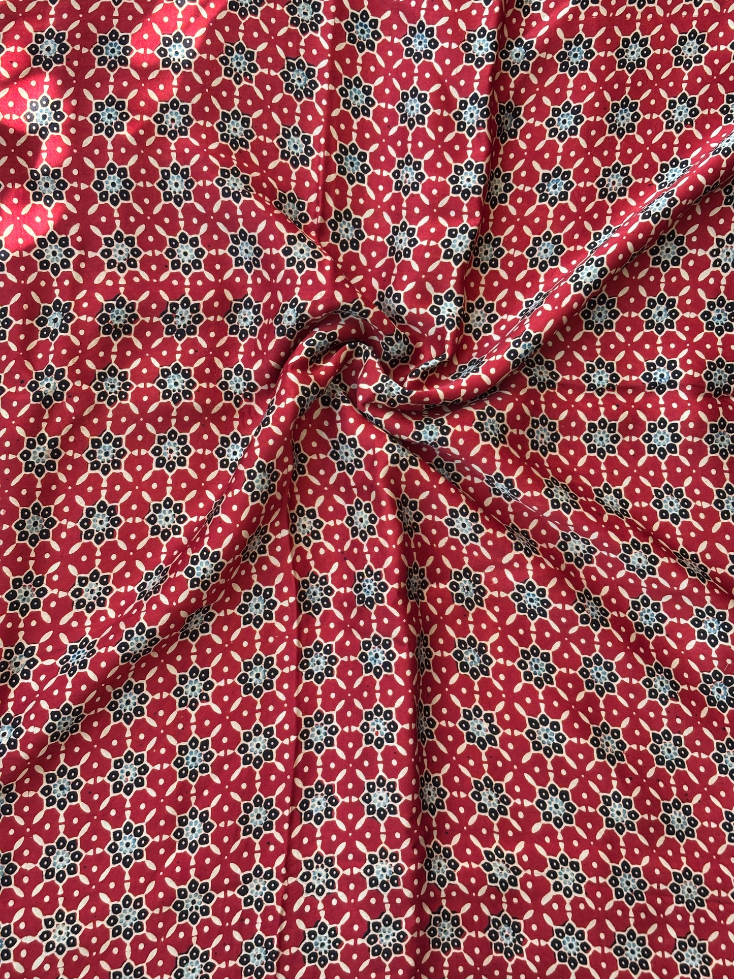 Small Geometrical Motif Block Printed Ajrakh Modal Fabric,closer view.