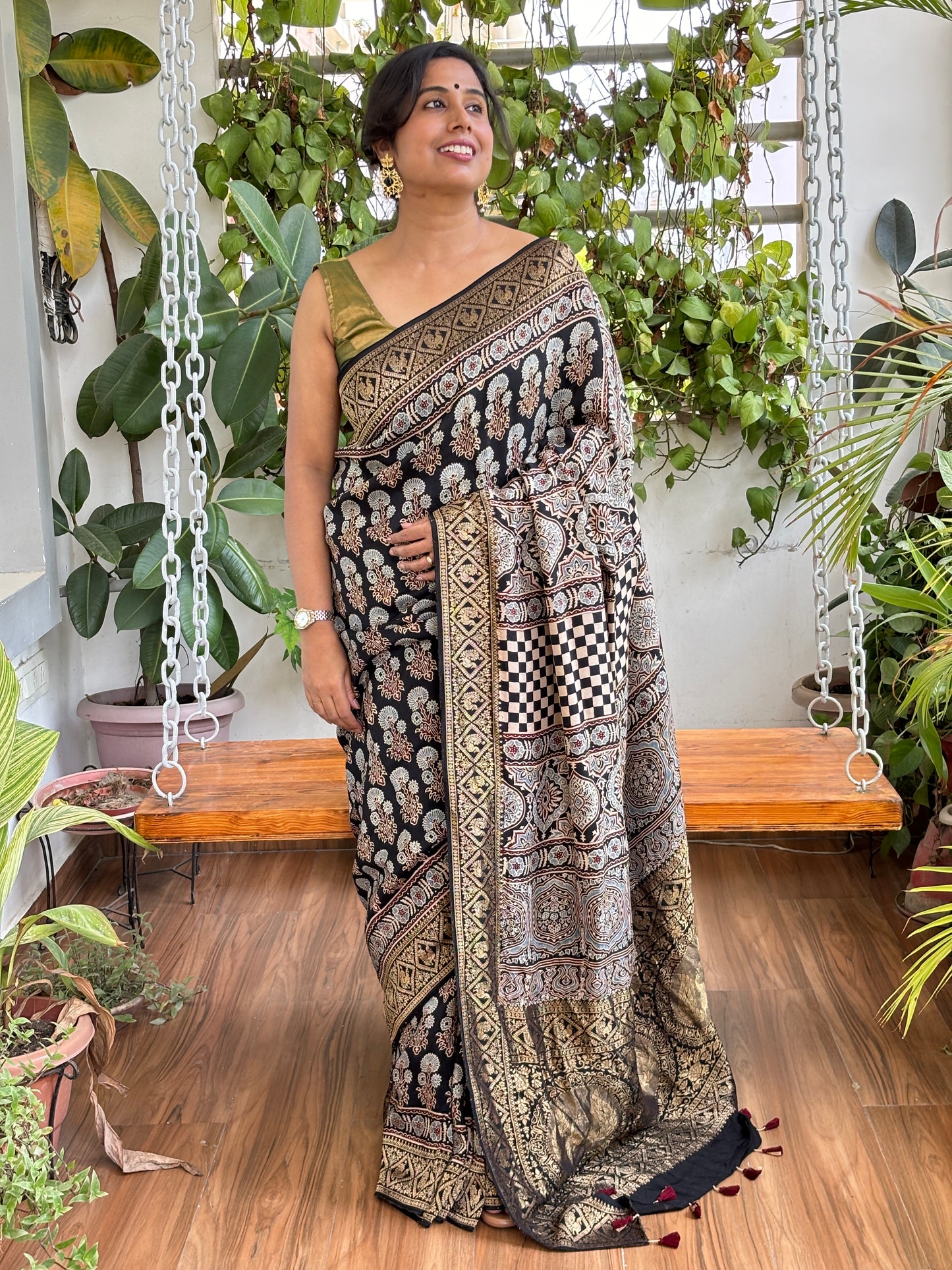 Kanchan- Natural Dyed Ajrakh Black Colour Dola Silk Saree with Marigold Motifs