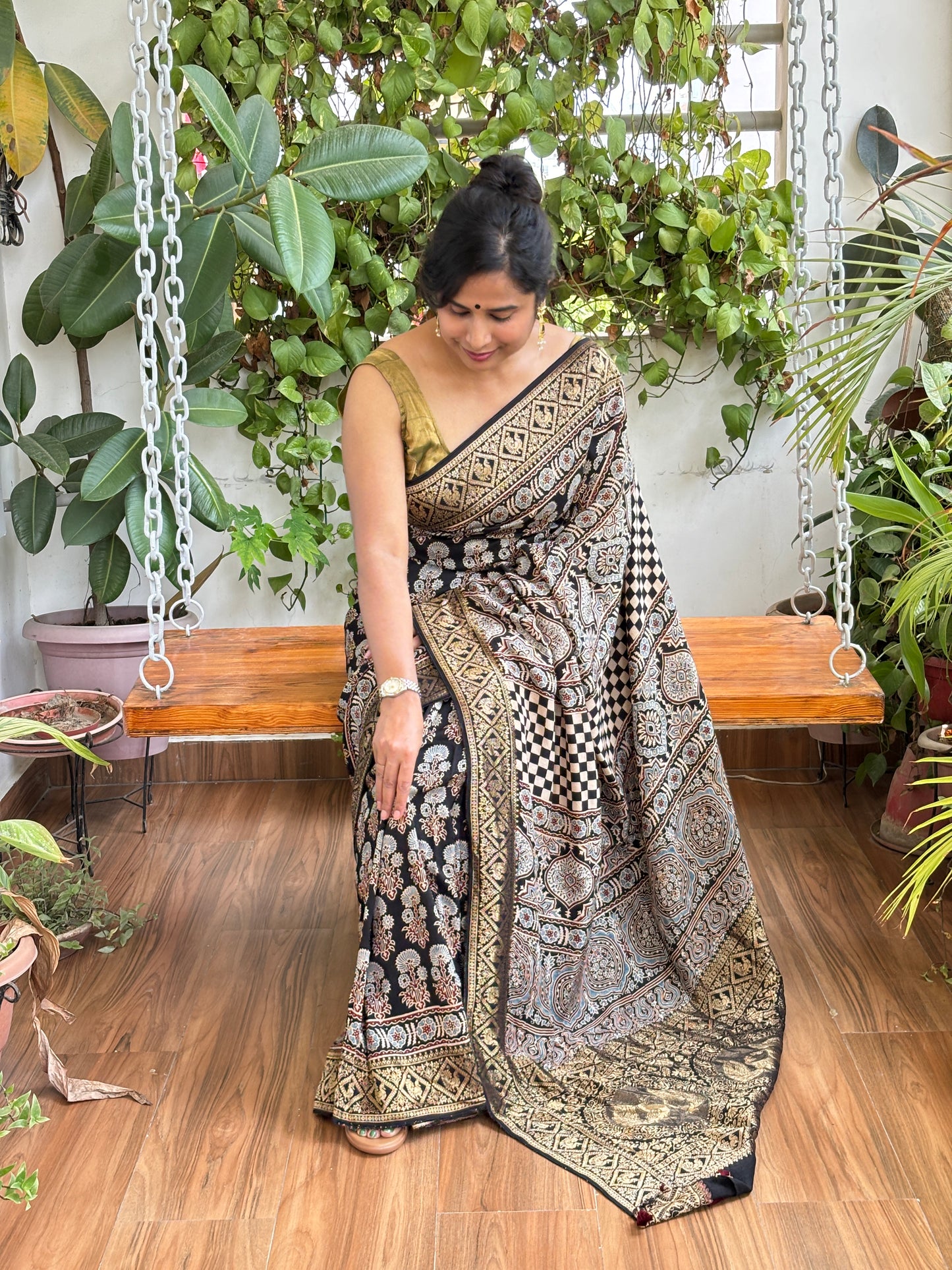 Kanchan- Natural Dyed Ajrakh Black Colour Dola Silk Saree with Marigold Motifs